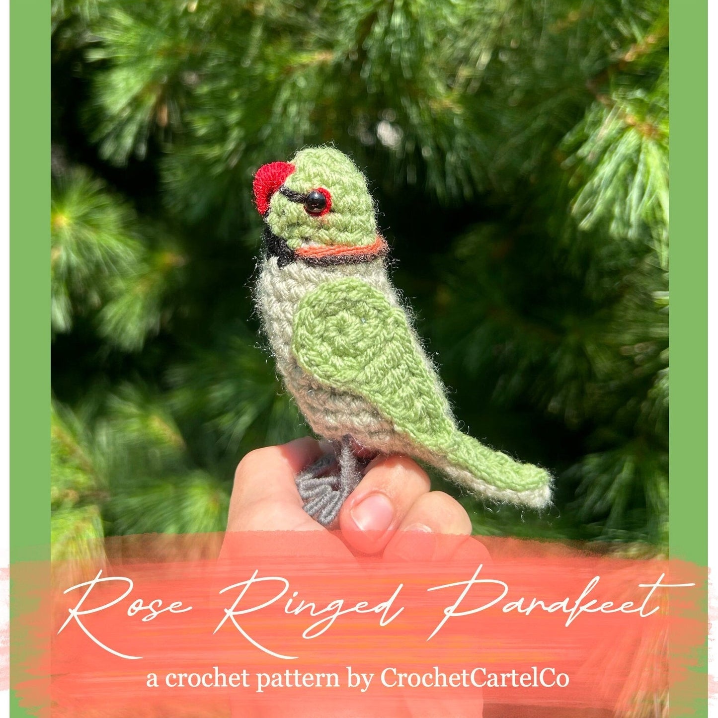 Crocheted green parakeet pattern, shown held in a hand with a blurred green background