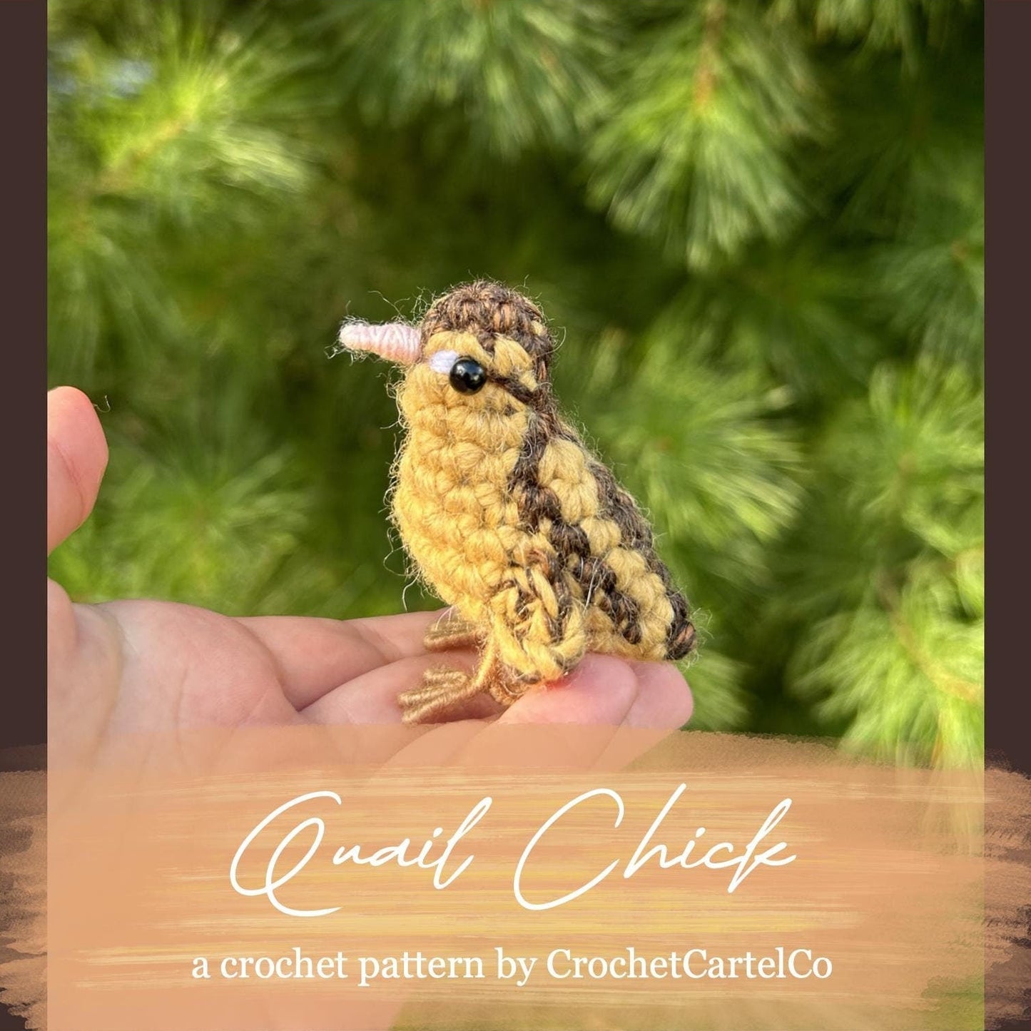 Crocheted quail chick crochet pattern shown held in a hand with a green leafy background.