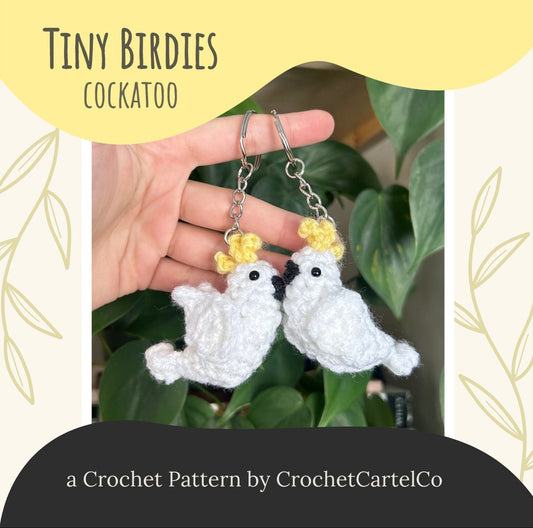 A crochet cockatoo crochet pattern shown with a green leafy background, featuring 'Tiny Birdies Cockatoo' by CrochetCartelCo.