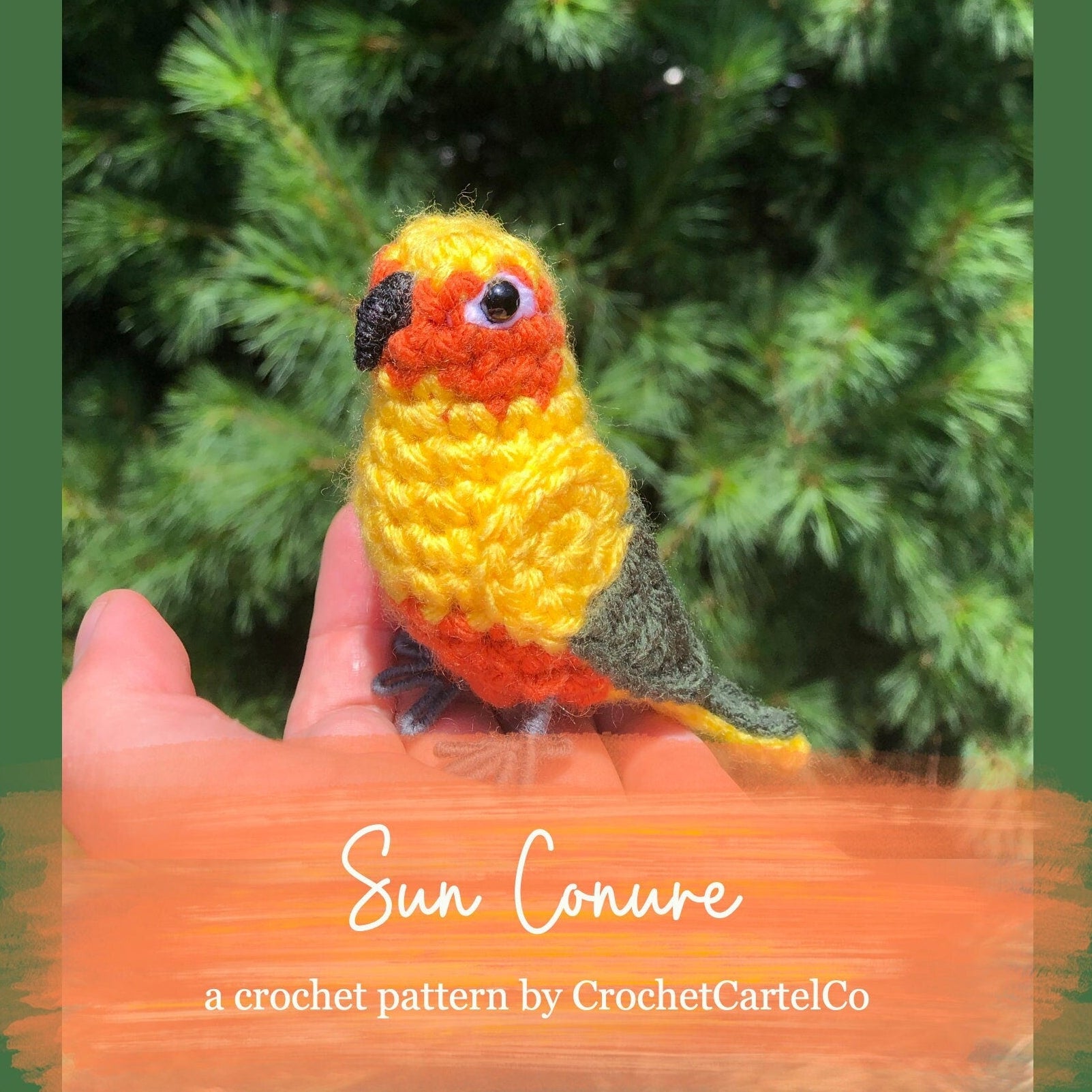A crochet sun conure bird crochet pattern shown with a green leafy background
