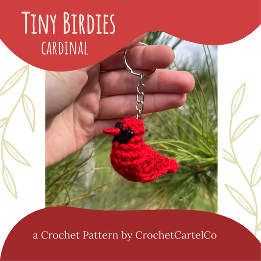 Crochet Pattern for a red crochet cardinal keychain, shown held in a hand with a natural background