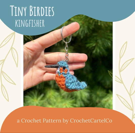 Hand holding a crochet keychain with 'Tiny Birdies Kingfisher, a crochet pattern by CrochetCartelCo' text
