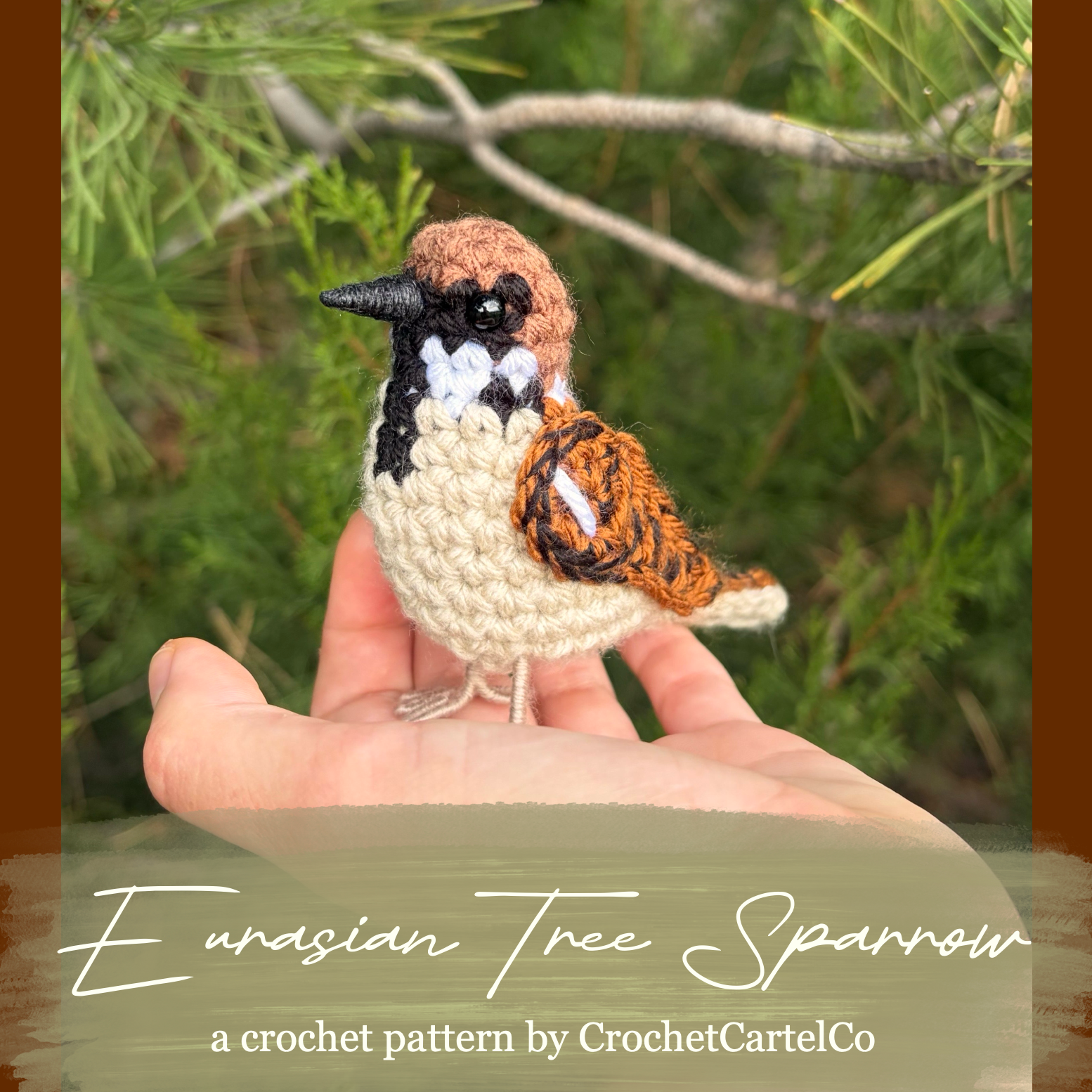 A crocheted bird figurine resembling a Eurasian Tree Sparrow is displayed on a person's hand against a blurred outdoor background of green foliage and branches. The text overlay at the bottom reads 'Eurasian Tree Sparrow' and 'a crochet pattern by CrochetCartelCo'.