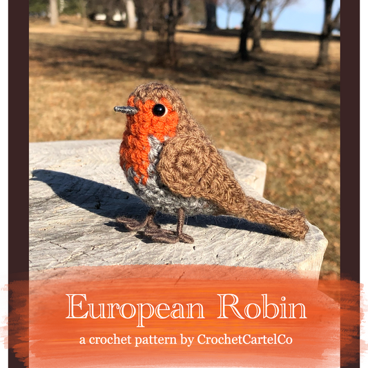 Crochet pattern for an European Robin, sitting on a rock with a natural background