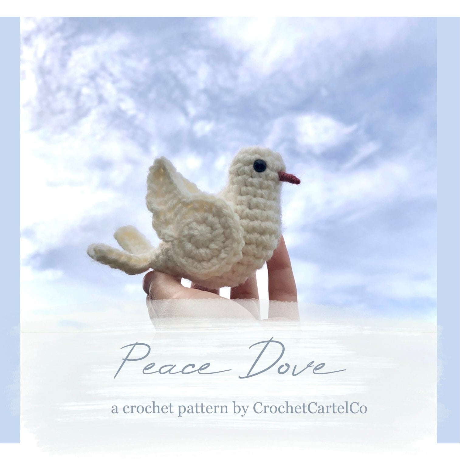 Hand holding a crochet peace dove against a blue sky with 'Peace Dove Crochet Pattern' text and 'CrochetCartelCo' branding.