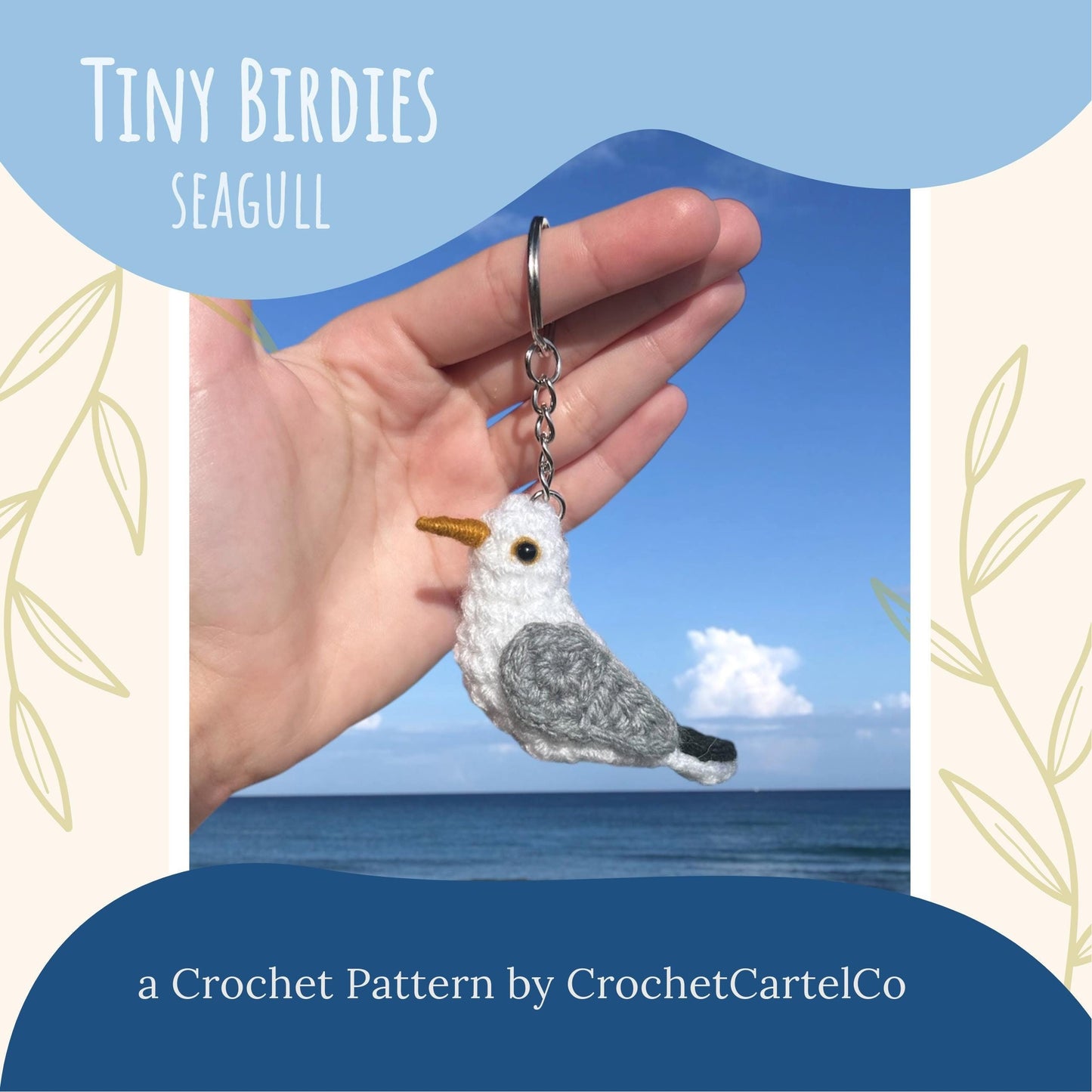 A crochet seagull keychain crochet pattern, shown with a scenic background