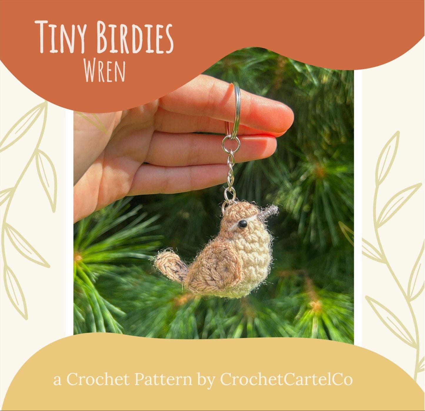 A crochet wren bird keychain crochet pattern shown with a green leafy background